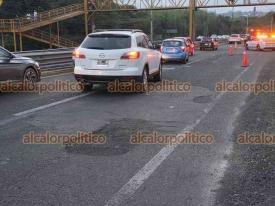Emiliano Zapata, Ver., 26 de julio de 2026.- Múltiples baches se observan en el tramo carretero donde este domingo murió un motociclista.